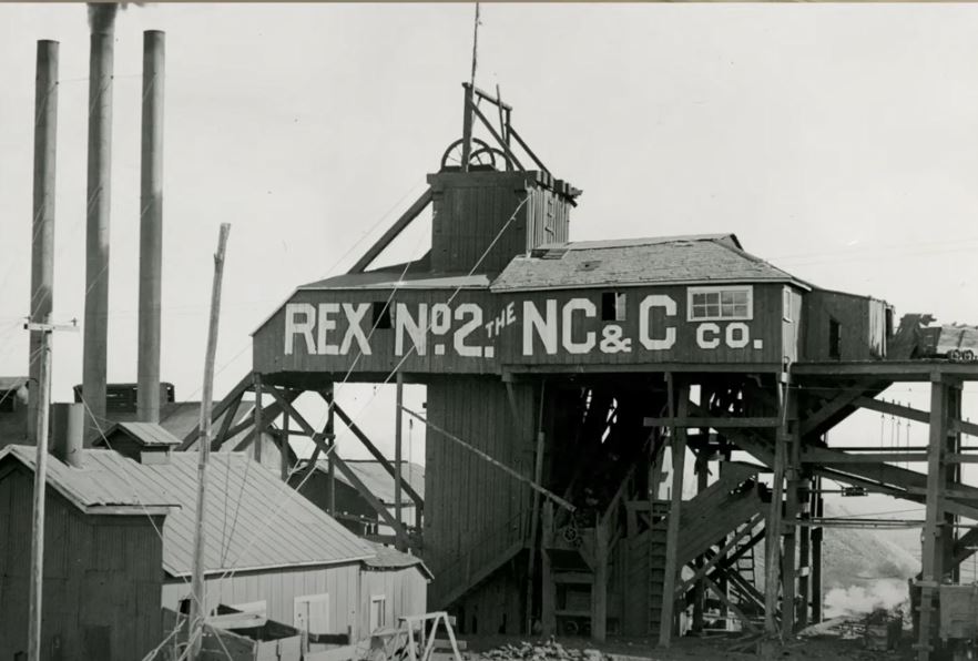 Building and smoke stacks of the Rex No.2 mine.