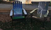 photo of two painted chairs outside