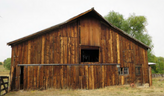 Photo of a wooden barn known as the chaussard barn