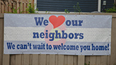 We Love Our Neighbors sign