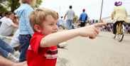 boy watching a parade