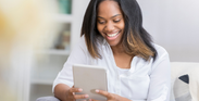 Woman Reading on Tablet