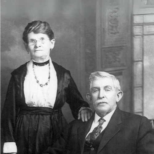 black and white photo of man and woman in formal portrait