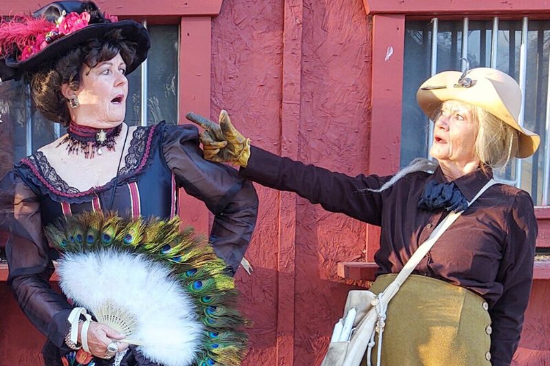 Two women in historic costumes